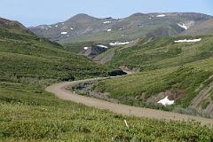 
Dempster Highway Snakes Through The Richardson Mountains With View To Communication Tower On Day Tour From Inuvik To Arctic Circle
